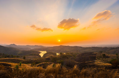 Scenic view of landscape against sky during sunset