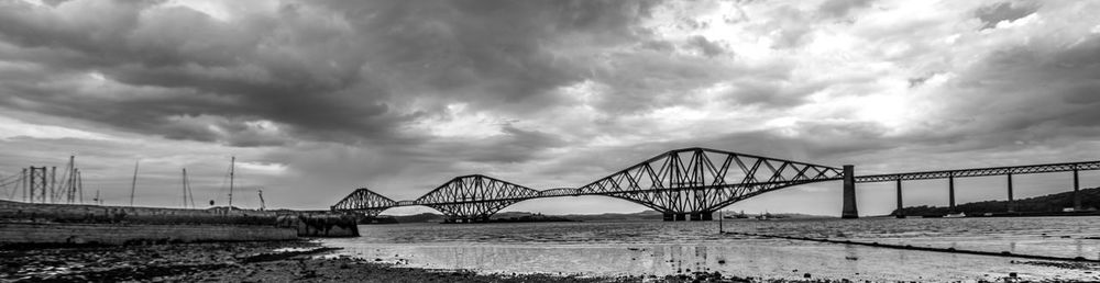 Bridge over sea against sky