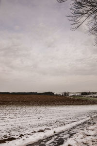 Scenic view of snow field against sky