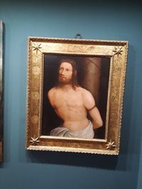 Midsection of shirtless man in museum
