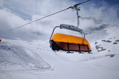 Ski lift and piste on zugspitze, the only glacier ski area in germany. it was a cloudy day.