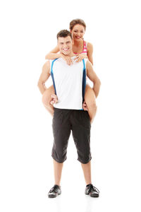 Portrait of young couple against white background