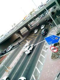 High angle view of cars on bridge in city against sky