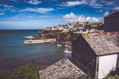 High angle view of buildings by sea