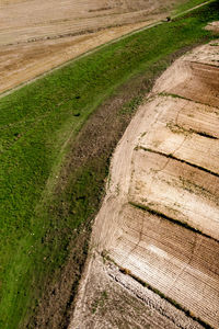 High angle view of footpath amidst field
