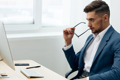 Businessman wearing eyeglasses at office