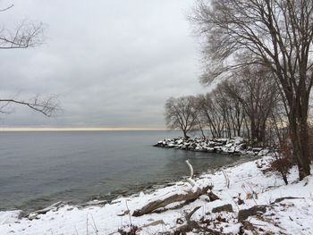 Scenic view of sea against sky during winter