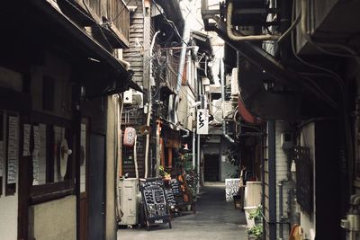 Narrow street amidst buildings in city