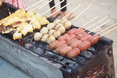 High angle view of meat on barbecue grill