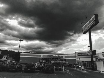 Road sign against sky