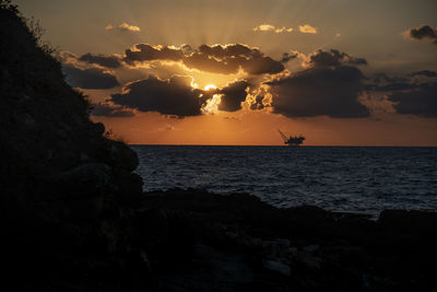 Scenic view of the oil pump and sunset