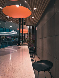 Empty chairs and tables in restaurant