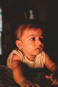 Close-up of cute baby boy at home