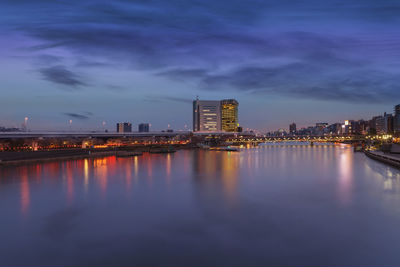 Sumida riverside apartments with skyscrapers of asahi beer headquarter and bunkyo city hall.