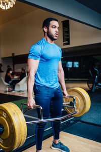 Young woman exercising in gym