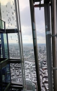 High angle view of buildings seen through window