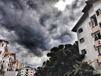 Houses in town against sky