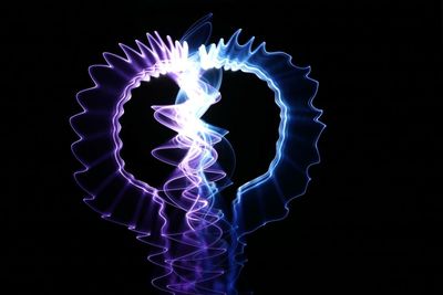 Low angle view of fire against black background