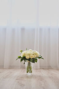 Close-up of white flower vase on table