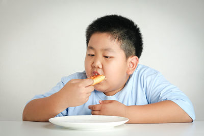 Portrait of boy eating ice cream