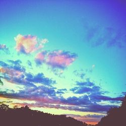 Scenic view of landscape against sky at sunset