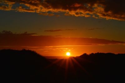 Scenic view of silhouette landscape against sky during sunset