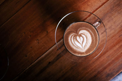 High angle view of coffee on wooden table