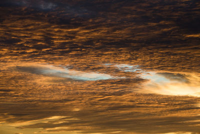 Low angle view of dramatic sky during sunset