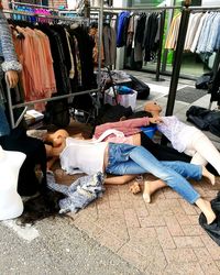 People relaxing in rack at market