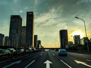 City street and modern buildings against sky