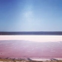 Scenic view of sea against blue sky