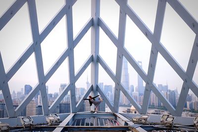 Low angle view of modern cityscape against sky