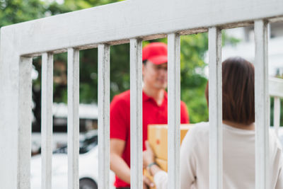 People standing by railing