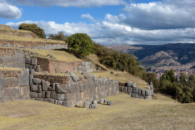 View of old ruins against cloudy sky