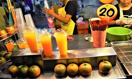 Various fruits and vegetables on display at market stall