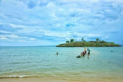 Scenic view of sea against cloudy sky