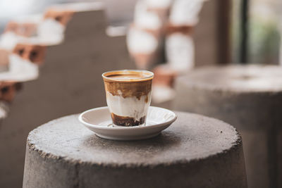 Close-up of coffee served on table at cafe