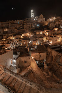 High angle view of illuminated buildings in city at night