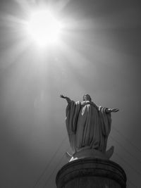 Low angle view of statue against sky