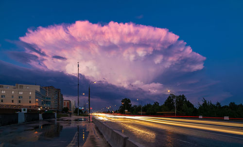 A large pink cloud in the form of a mushroom, in the evening. tinting