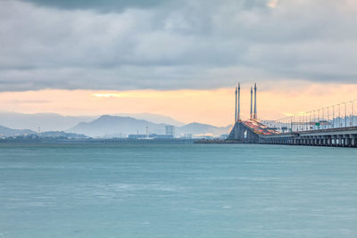 View of suspension bridge over sea