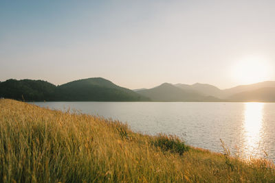 Scenic view of lake against clear sky