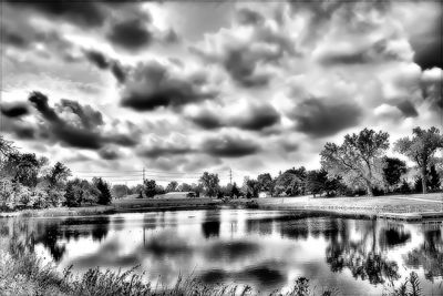 Scenic view of lake against cloudy sky