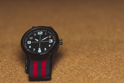 Close-up of clock on table