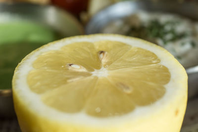 Close-up of lemon in plate on table