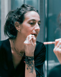 Young woman smoking cigarette