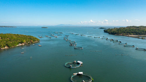 Fish farm with cages for fish and shrimp. farming aquaculture or pisciculture practices. philippines