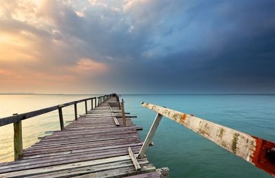 Pier over sea against sky