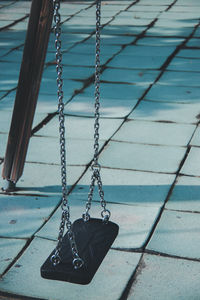 Empty swing hanging at playground