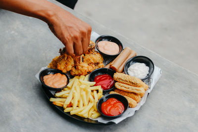 High angle view of person preparing food on table